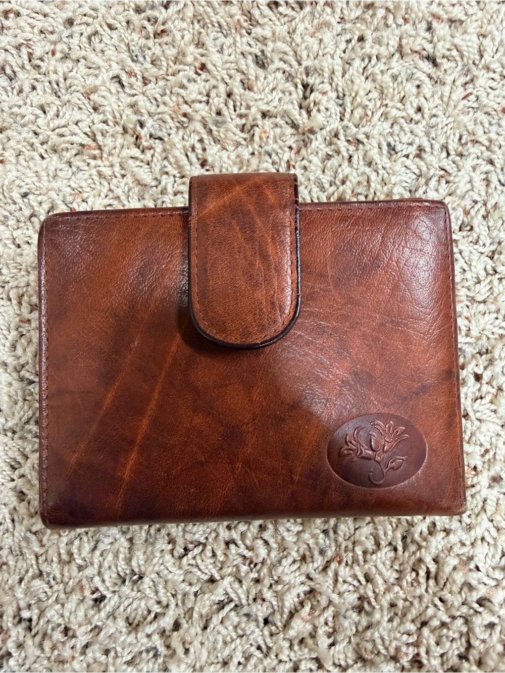 Buxton Brown Leather Tab Closure Wallet with Embossed Floral Motif